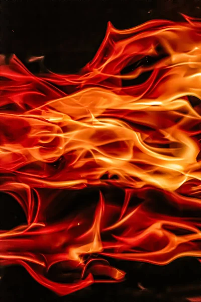 Red fire flames as nature element and abstract background