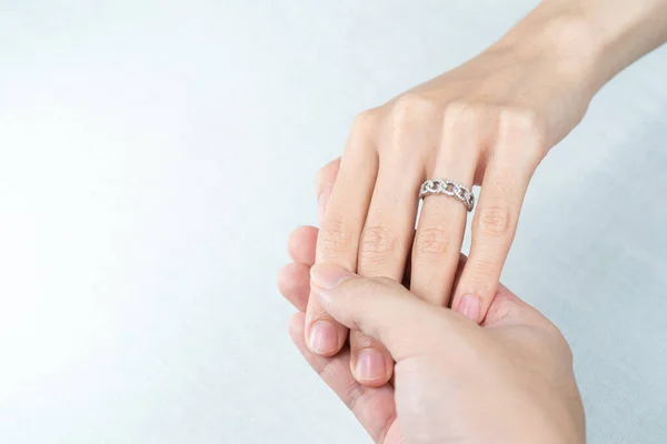 Man Putting Diamond Ring Woman Hand White Background — Stock Fotó
