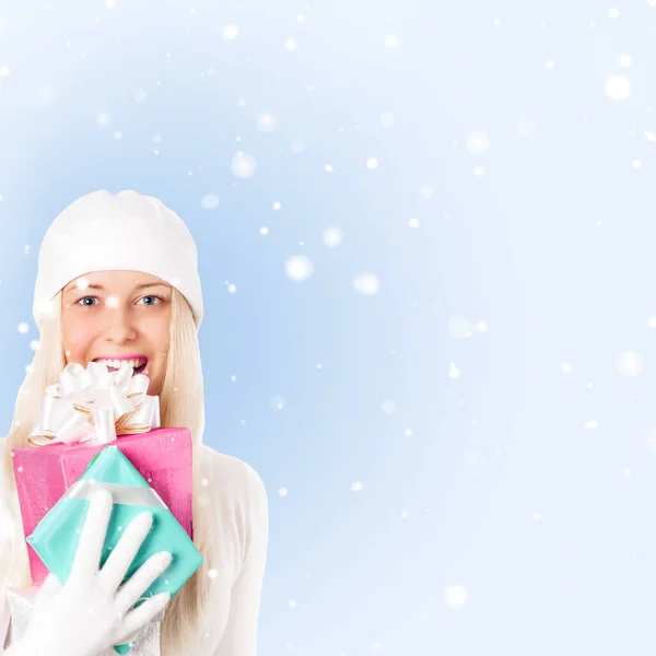 Happy Woman Holding Christmas Gifts Blue Background Snow — Stock Photo, Image