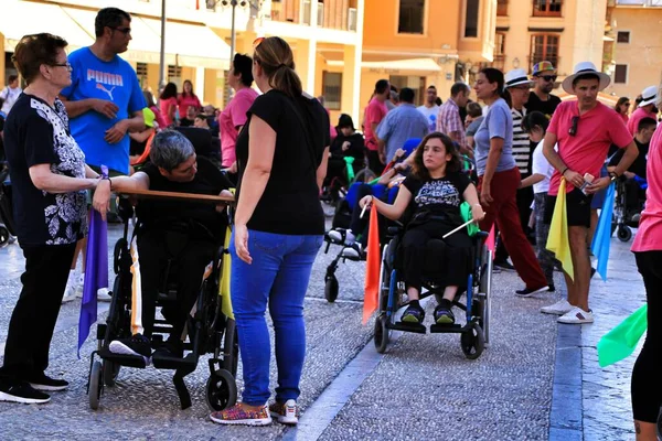 People participating in activities for the world day of cerebral palsy