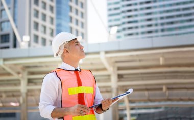 Engineering civil, Construction engineers discussion with architects at construction site or building site of high-rise building with Surveying for making contour plans