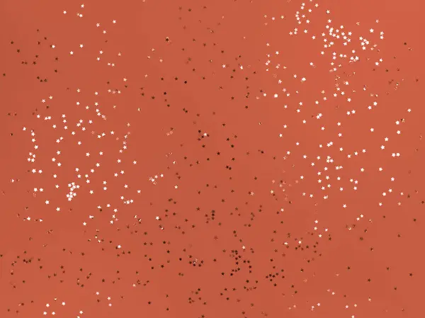 Estrellas Confetti Brillando Sobre Fondo Naranja — Foto de Stock