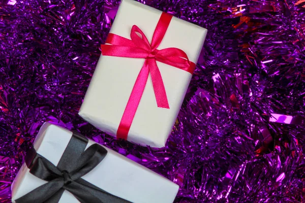 Gifts Wrapped White Paper Purple Tinsel — Fotografia de Stock