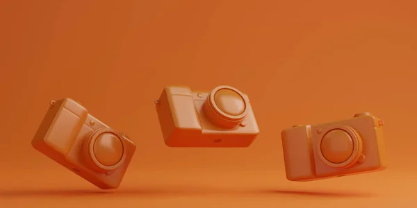 Orange Digitalkameras Auf Orangefarbenem Hintergrund Technologiekonzept — Stockfoto