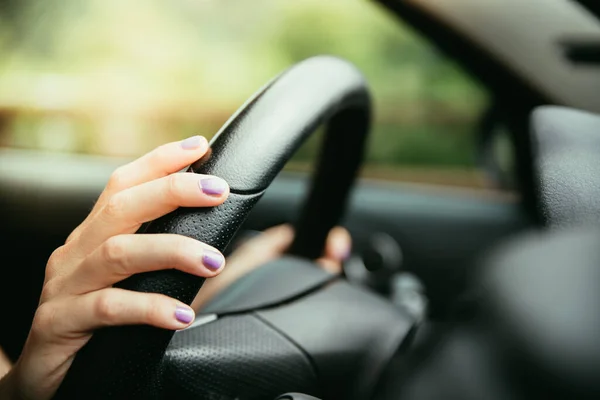 Sports Car Steering Wheel Hands Young Girl Purple Nail Polish — Stock Photo, Image