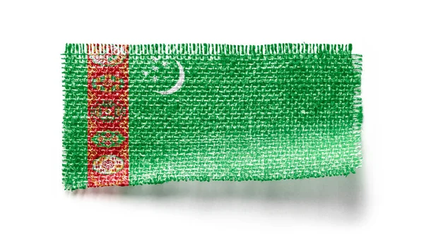 Turkmenistan Flagga Ett Tygstycke Vit Bakgrund — Stockfoto