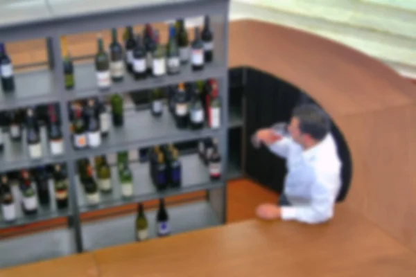 Wine Tasting Man View Bottle Shelves Counter Blur Effect — Stock Photo, Image