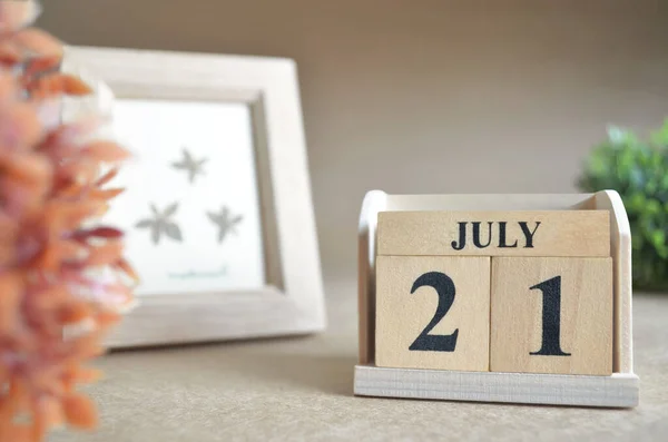 stock image wooden calendar with month of July, planning concept