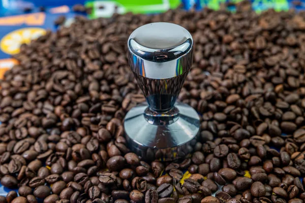 coffee beans with steel coffee press