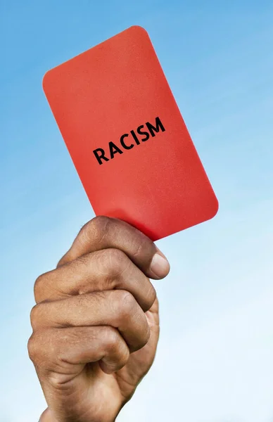 Man Holding Out a Racism red card