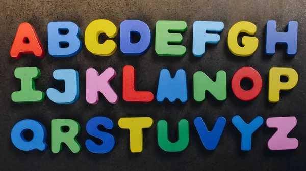 A, B and C wooden alphabet letters for learning concept
