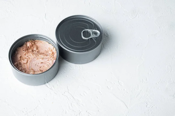 Canned tuna, fish preserves, in tin can, on white background, with copyspace and space for text
