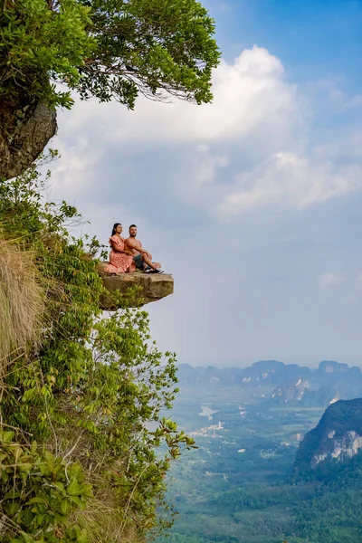 couple mid age men and woman trekking in the Thai jungle near Krabi hiking to the top of Khao Ngon Nak Nature Trail Krabi Thailand or Dragon Crest,couple, Thailand