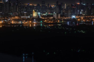 Beautiful view of Bangkok city, Beauty skyscrapers along Chaopraya river in the night, making the city modern style. 