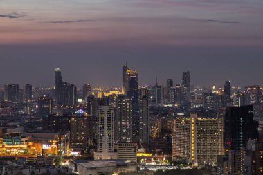 Sky view of Bangkok with skyscrapers in the business district in Bangkok in the evening beautiful twilight give the city a modern style.