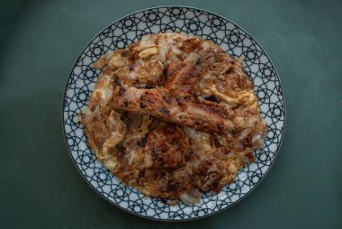 Crisp Fried noodle and eggs with Barbecue pork spare ribs in a japanese dish. top view.