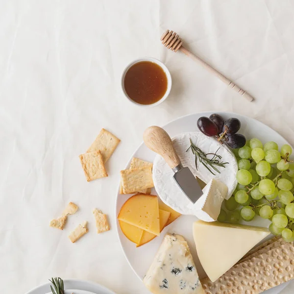 Cheese Plate Assortment Served Honey Grapes Bread Rosemary — Stock Photo, Image