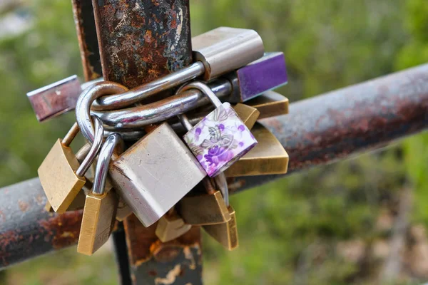 Love Commitment  padlocks on bridge close up