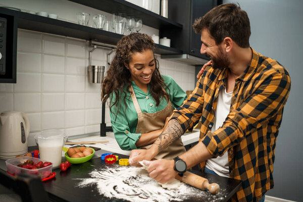 "young couple in kitchen"