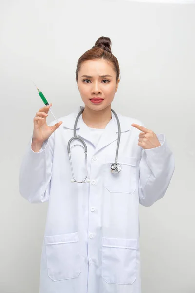 Doctor Woman Holding Syringe Hand Pointing Shocked Shame Surprise Face — Stock Photo, Image