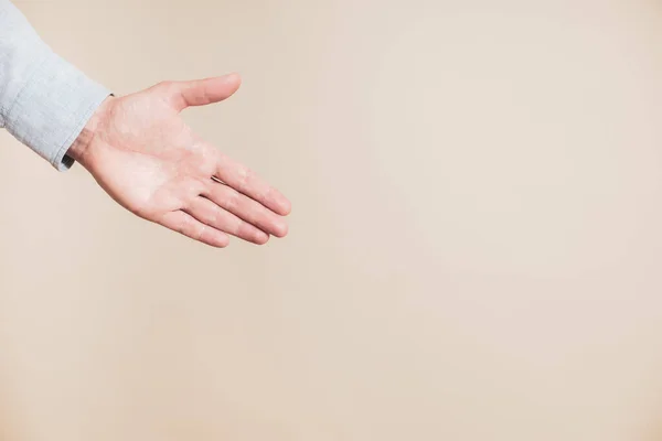 Male Hand Showing Something Beige Background — Stok fotoğraf