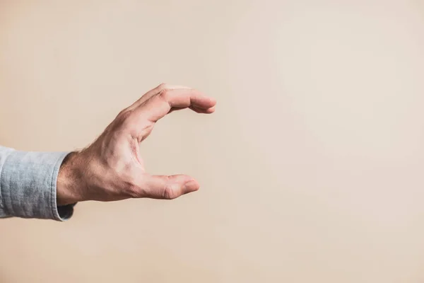 Male Hand Holding Gesture Beige Background — Stok fotoğraf