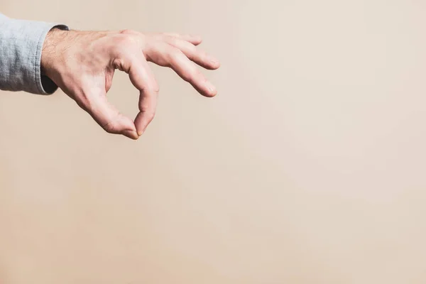 Male Hand Picking Gesture Beige Background — Stok fotoğraf