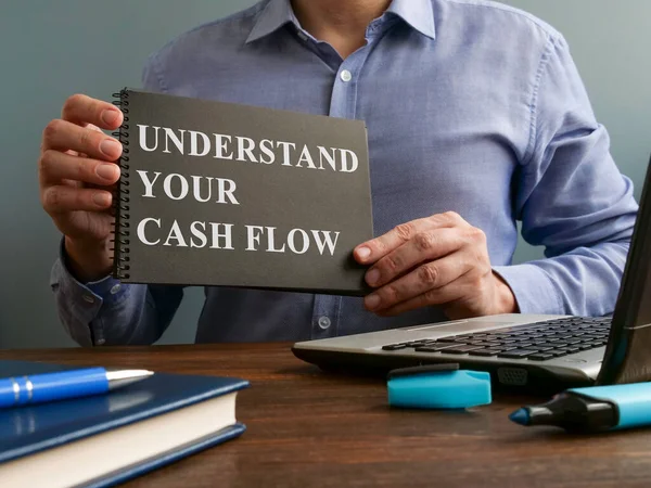 Man Shows Understand Your Cash Flow Sign Page — Stock Photo, Image