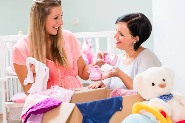 Pregnant Woman Friend Sharing Baby Clothes — Stock Photo, Image