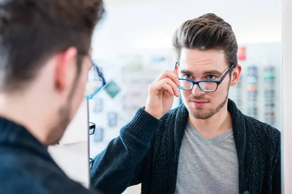 Man Testing Glasses Optician Shop Mirror — Zdjęcie stockowe
