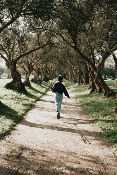 Woman Running Giant Trees Vintage Tones Spring Day Copy Space — Foto Stock