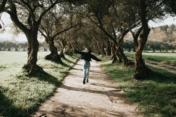 Woman Running Giant Trees Vintage Tones Spring Day Copy Space — Foto Stock
