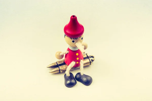 Bullets Wooden Pinocchio His Long Nose — Stock Photo, Image