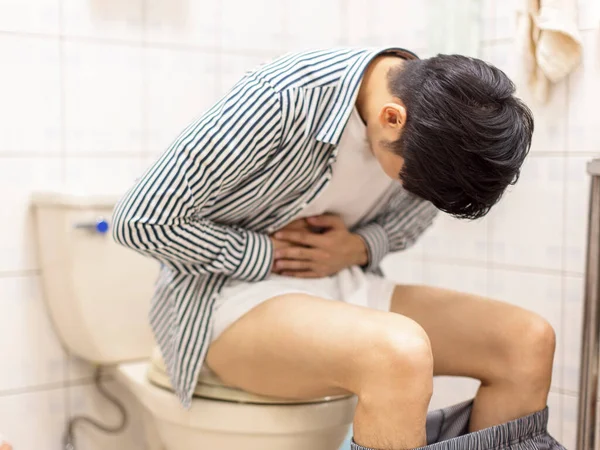 Young Man Holding His Abdomen Feels Sick Constipation Toilet — Stock Photo, Image