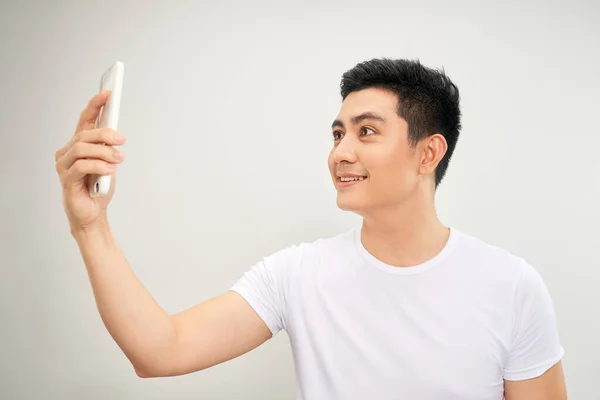 Smiling Young Asian Man Making Selfie Photo Smartphone White Background — Stock Photo, Image