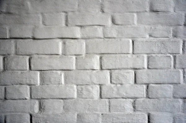 塗料で覆われたアンティークの白レンガの壁 — ストック写真