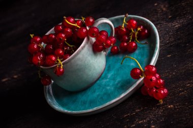 close-up shot of fresh organic red currant berries on tabletop for background