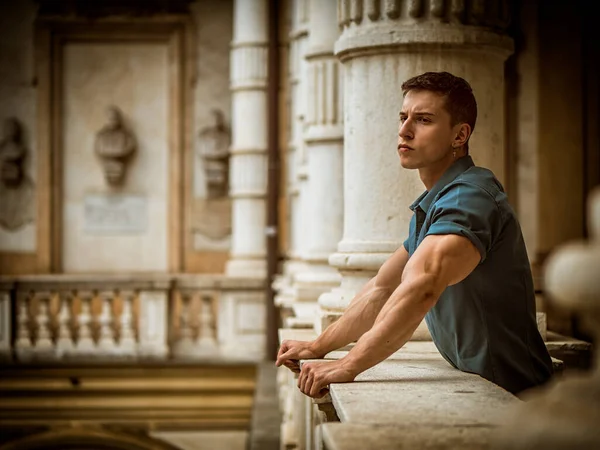 Young Man Leaning Marble Staircase Railing — Stok fotoğraf