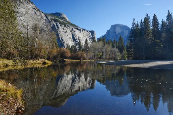 Nature scenery of mountains at calm river, Yosemite, USA.