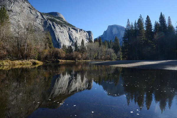 Nature scenery of mountains at calm river, Yosemite, USA.