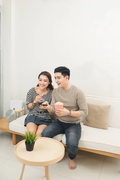 stock image Young asian couple payment online using laptop buying movie ticket