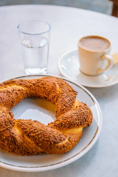 Turkish traditional bagel simit with Turkish coffee in Istanbul