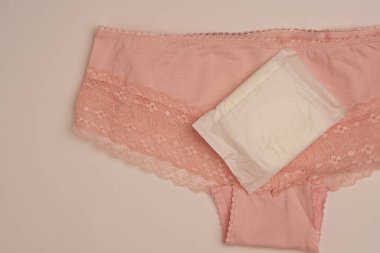 Tampon pedleri iç çamaşırları kadın hijyen koruma ışığı arka planı