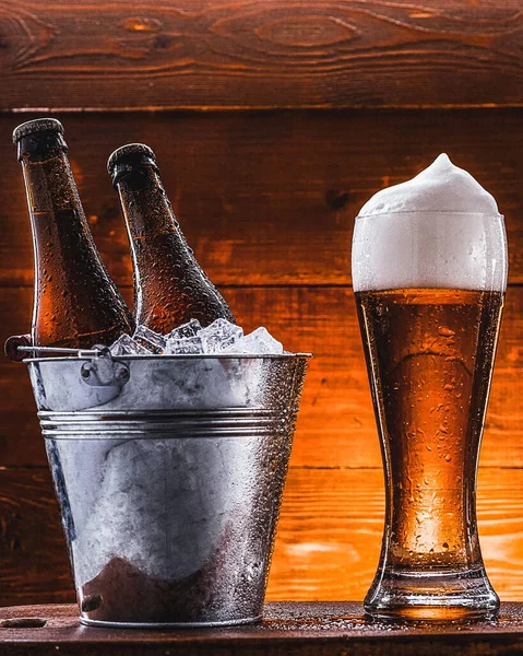 Two Bottles Beer Bucket Ice Glass Beer Lush Foam Next — Stock Photo, Image