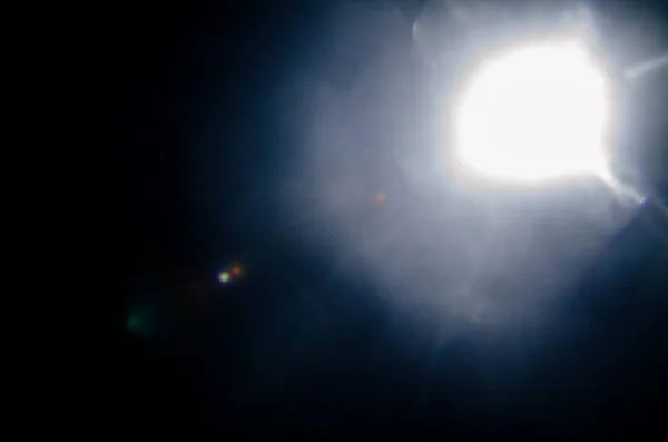 自然の太陽フレアやファーを抽象的な背景の黒の星 — ストック写真