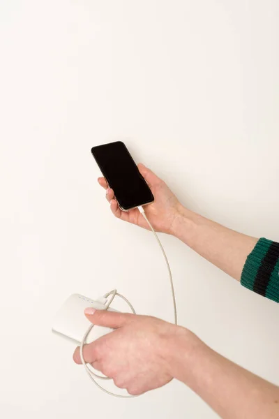 Female Hands Holding Using Smartphone While Charging Power Bank — Stock Photo, Image