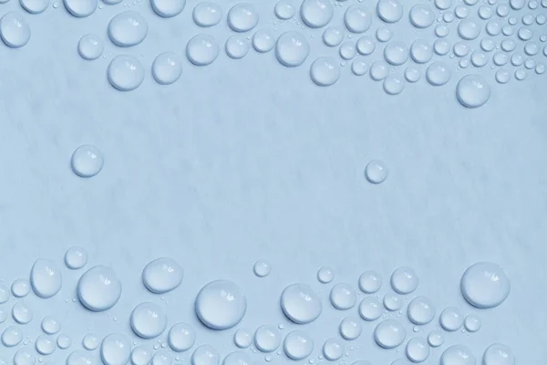 Große Und Kleine Wassertropfen Auf Blauem Hintergrund Nahaufnahme — Stockfoto