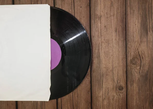Starý Vinylový Desku Papírové Pouzdře Dřevěném Rustikálním Pozadí — Stock fotografie
