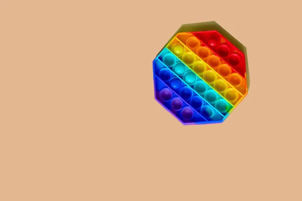 Popular Multicolorido Antistress Pop Brinquedo Encontra Fundo Laranja — Fotografia de Stock