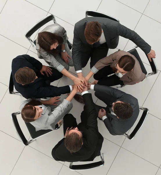 Top View Groep Werknemers Met Hun Handen Opgevouwen — Stockfoto